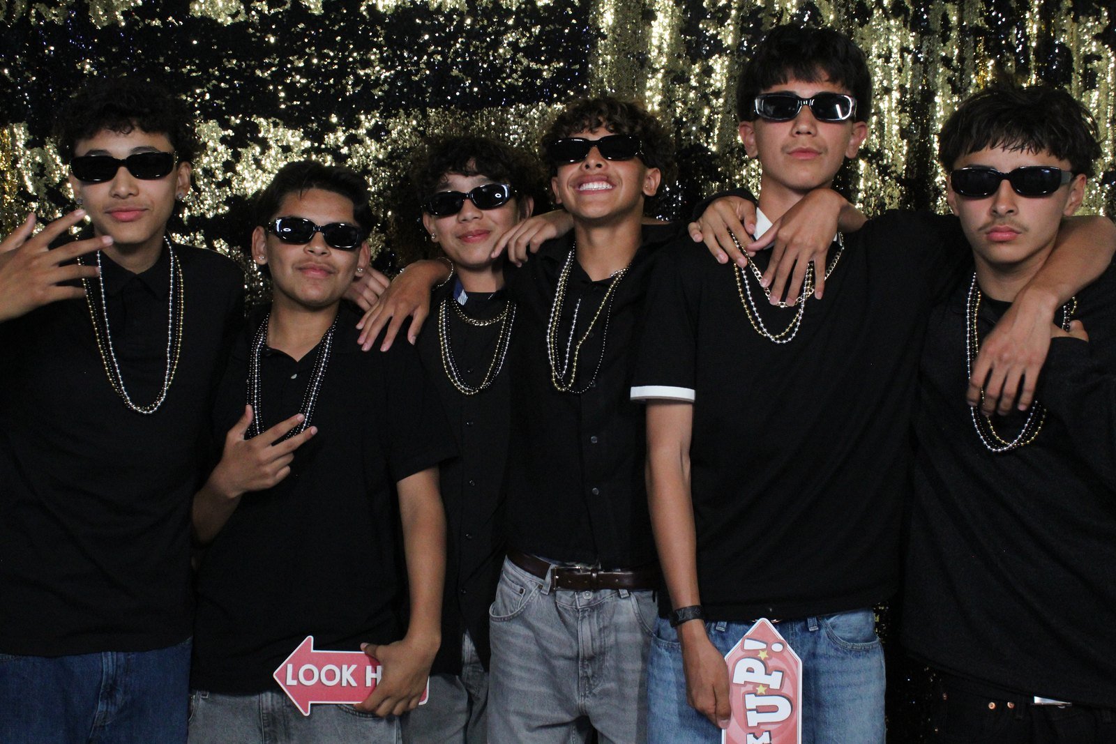 Students celebrating together at a Los Angeles school dance photo booth